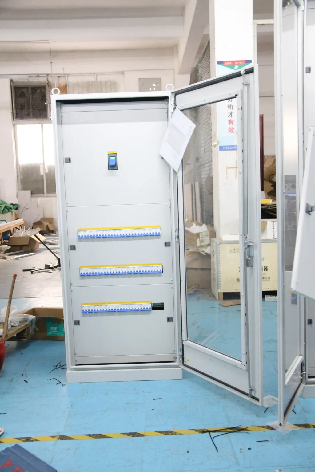Large electrical control cabinet with open glass door - Africa Vaccine Cold Chain Power & Temperature System - E-Abel - E-Abel - Knowledge Hub - E-Abel - E-Abel Grande armoire électrique à commande avec porte vitrée ouverte